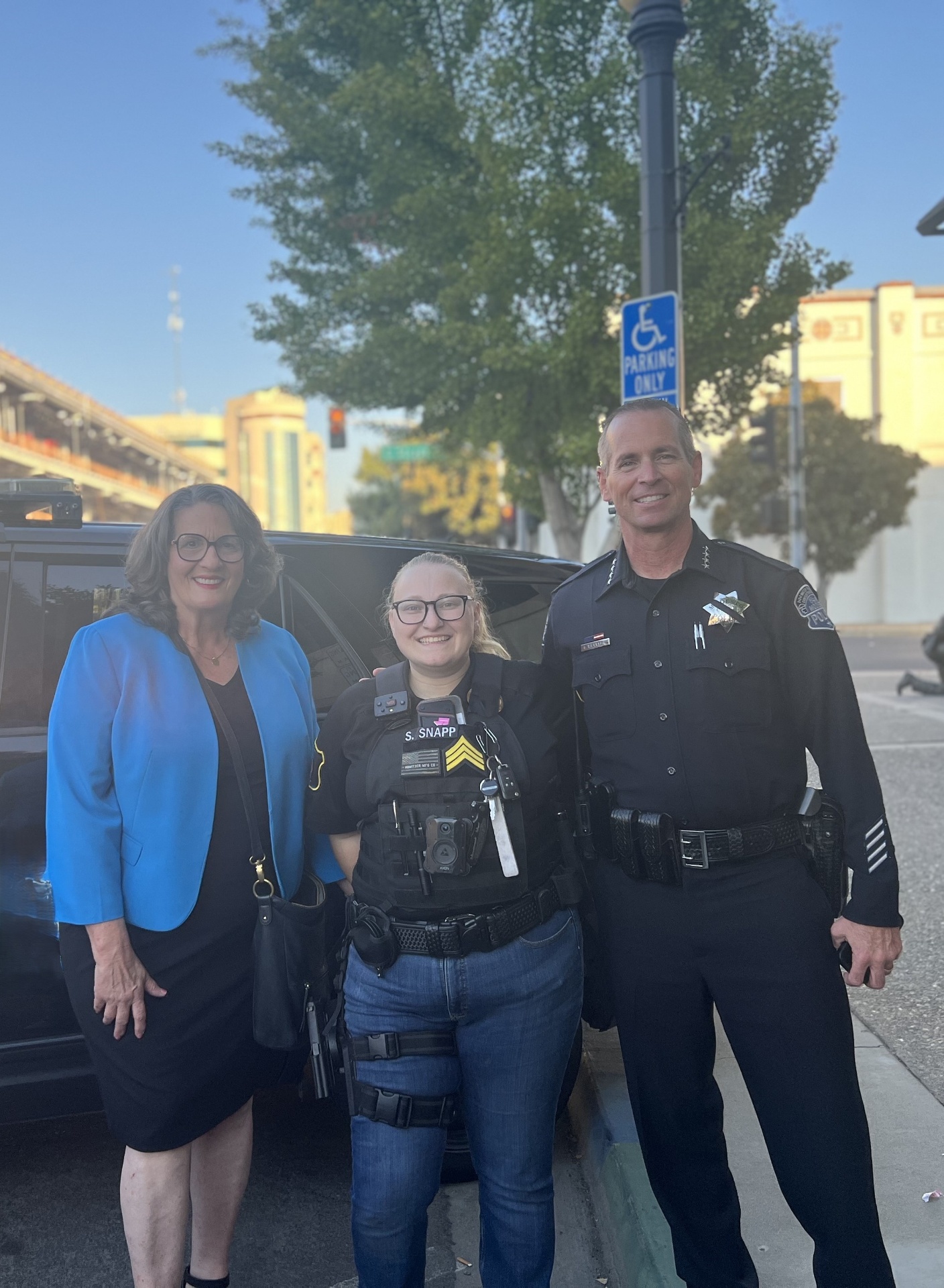 Modway officer with city leadership at a downtown Modesto event