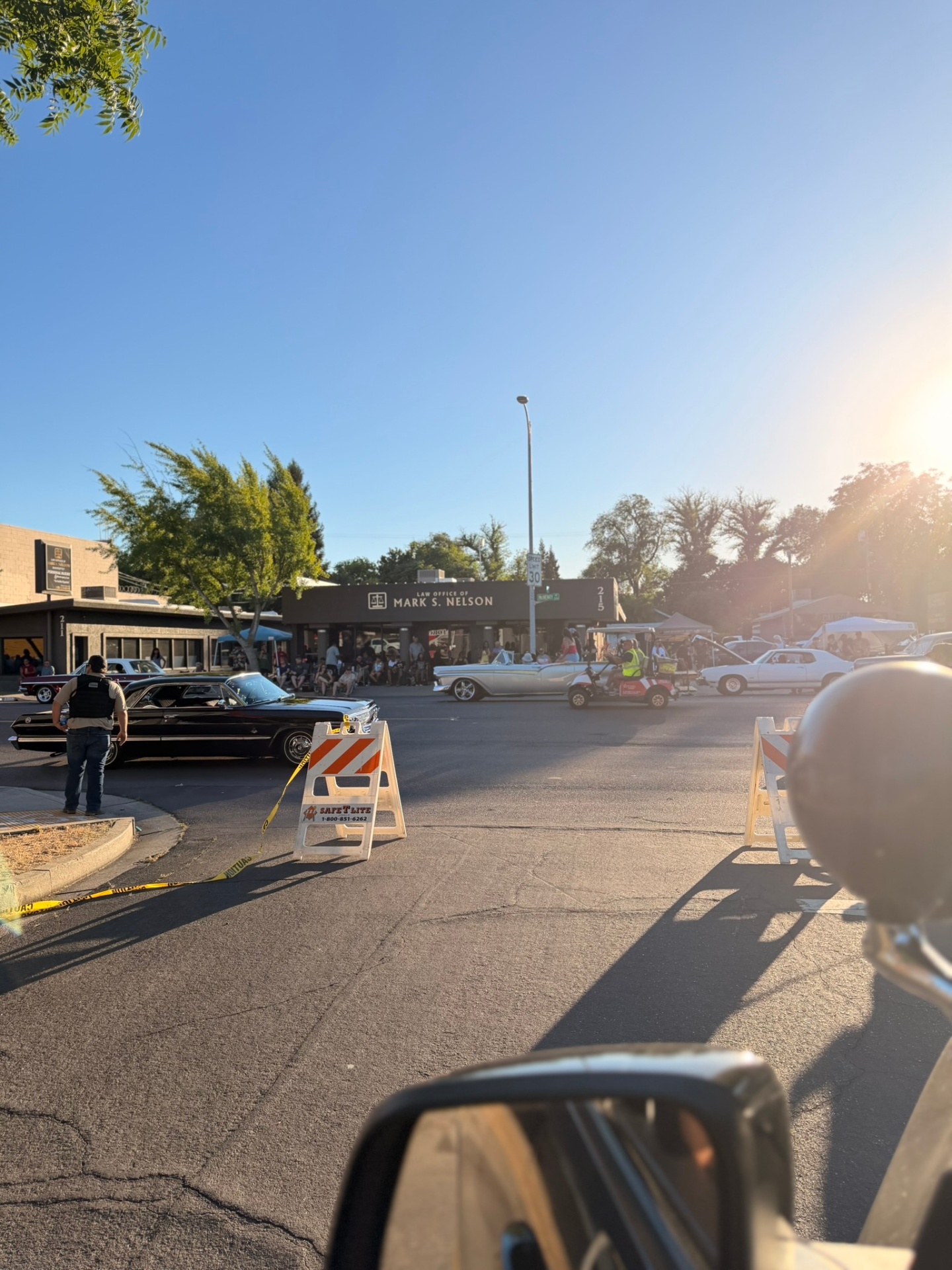 Street lined with spectators at the car show