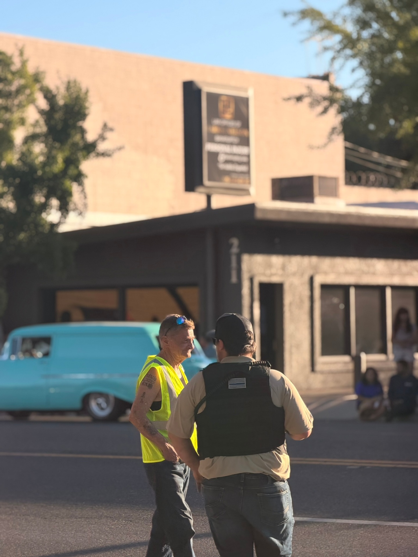 Security volunteer coordinating with an officer